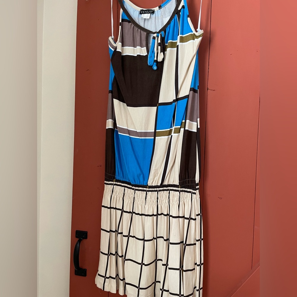 Venus size small. Jumper. This is not a short jumper. This is skirt jumper.
